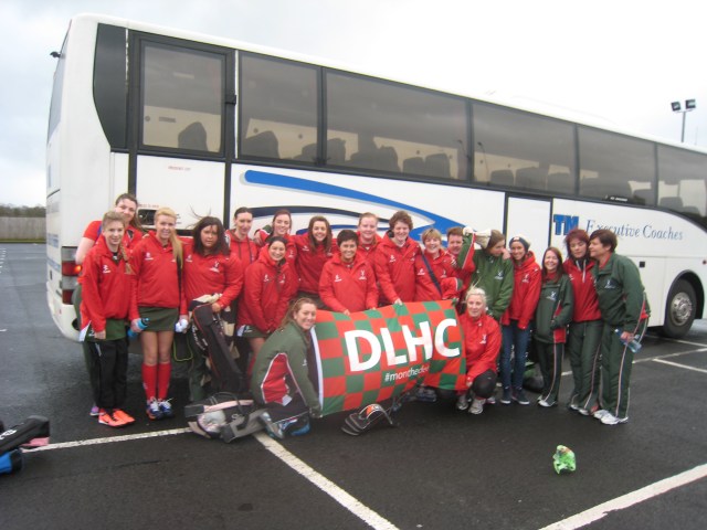 Donaghadee Ladies Hockey Club 1st and 2nd XIs unveil the new DLHC tour fleg on the bus trip to Coleraine